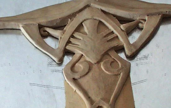 I sculpted 1/2 of the guard from clay. I worked on a mirror thinking that it would give me a better view of the complete guard. I think it was too flat to make much of a difference, though.