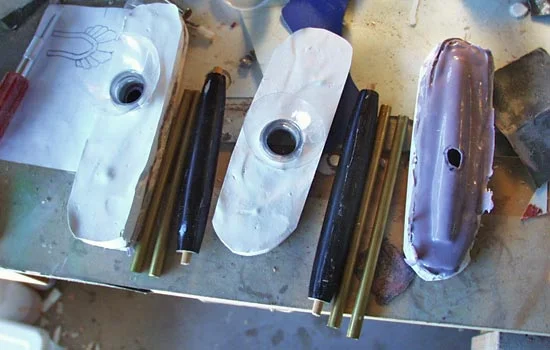 I cut the lathed grip master into its components and cast them in silicone rubber.