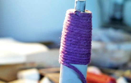 I notched the end at an angle and CA glued the end. I coated the grip with Elmer’s wood glue and started winding.