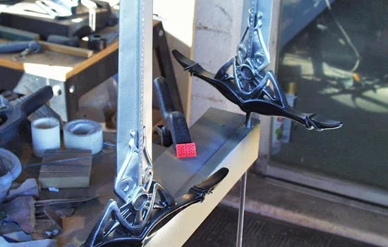 I painted the blades with a gloss black to show any last flaws and to act as a base coat for the metallic paint and then applied a Krylon Chrome paint for the blade.
