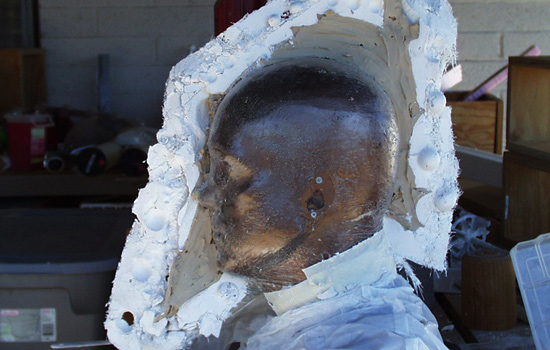  The left half of the mold removed. You can see how much clay was used to form the helmet. 