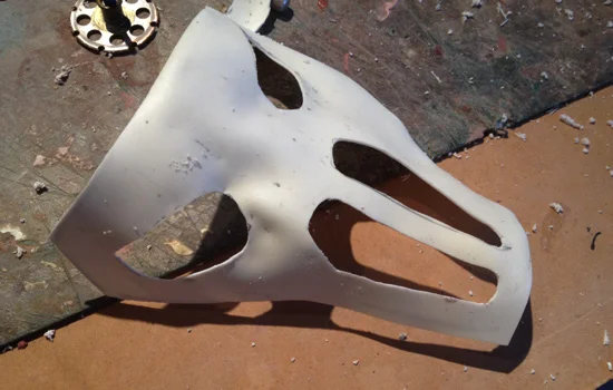 To cover my eyes while wearing the helmet, I heat formed some styrene and pressed it into the inside of the mask. I trimmed out the eye and nose holes.