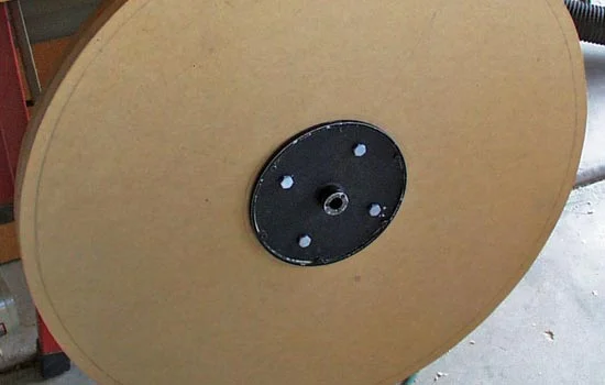 My cheap-o lathe only turns over the bed but it has a disk sander on the outside. I suspect that this was stupidly dangerous BUT I took the sanding disk off the machine, drilled holes in it and mounted the MDF to the plate.