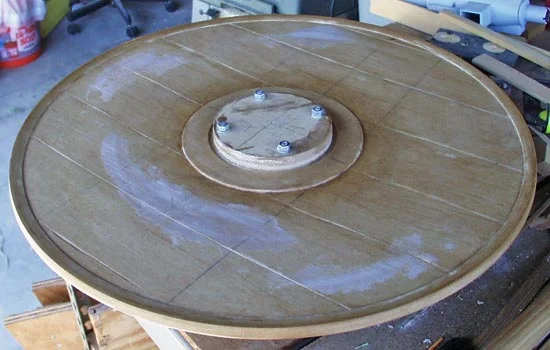 Here is the finished inside with the plate still attached. I brushed both sides with a generous coat of shellac to seal the MDF and then removed the plate and cut out the center hole.