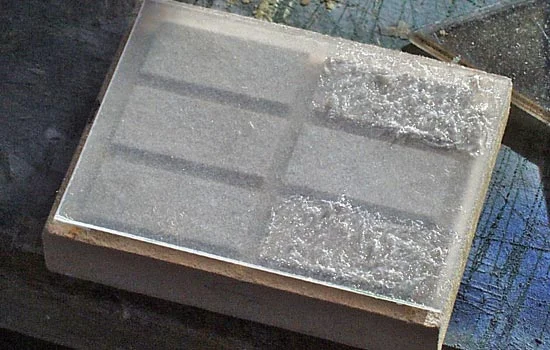 After much experimentation, I figured out the window glass. I used .02 clear styrene, frosted it with Krylon Matte Finish and then added clear caulk, stippled with a toothpick, for the “shower glass” panes.