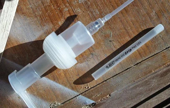 For the top lamp, I needed two plastic frosted tubes to make the inner and outer lamp lens. A Bic pen and a Dial Complete pump (area around the spring) supplied the parts.