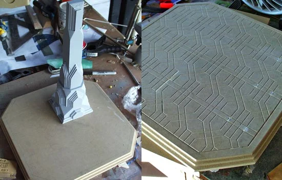 The base was cut from 3/4″ MDF with steps carved with a router. The tile design was transferred to the board by placing the laser print face down, brushing lacquer thinner on the paper and then rubbing the back of the paper. The thinner softens the toner allowing it to transfer to the board. I used a carving bit in the Dremel to carve the tile seams.