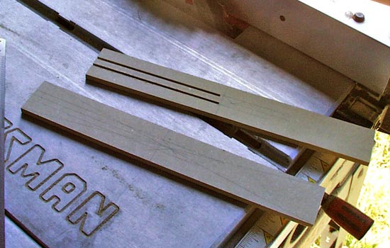 The hilt was constructed out of 1/4″ MDF as a box. The center channel was cut out with the table saw and cleaned up with X-acto knife and files.