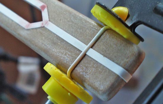 The trim was cut out of .040 strip styrene and CA glued to the MDF. I used a strip of half-round styrene for this band.