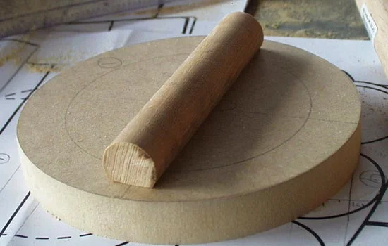 I cut a dowel (fitting inside the wrist) to give me something to hold while wearing the hand. The hand was also lathed for smoothing and shaping, then the “palm” was defined with a cut on the table saw.