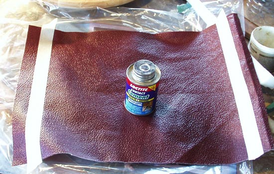  BUT before I could do that, I needed to line the inside to make it more comfortable to wear. I found a cool burgundy leather textured vinyl that would work great. I cut a piece to size, glued the seam with contact cement. 
