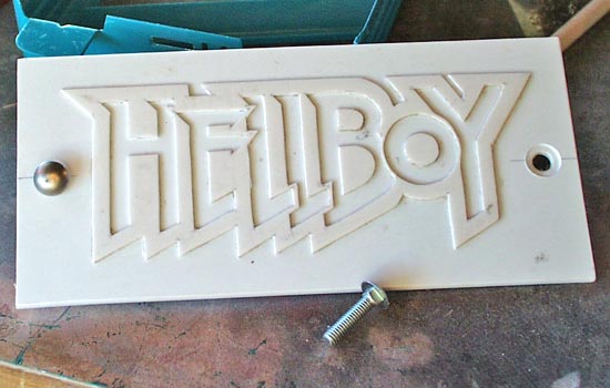  I wanted to make a nice logo plaque to mount on the base. I printed out the Hellboy comic logo in reverse, placed it face down on .060 styrene, wet it with lacquer thinner and burnished. When you remove the paper, a nice copy is magically applied to