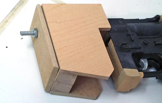 The new magazine well was made from MDF as well as the “plate” that will eventually hold the muzzle shroud. All were attached using the threaded rod (test fitted here).