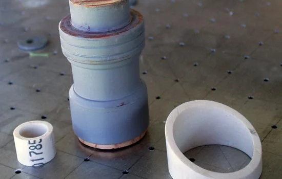 The pieces for the scope: 1″ PVC to attach the front lens, Lathed wood for the body of the scope and a piece of 2″ PVC for a last minute addition to the eyepiece.