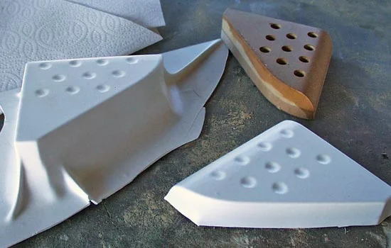 The barrel shroud was vacuformed over MDF masters.