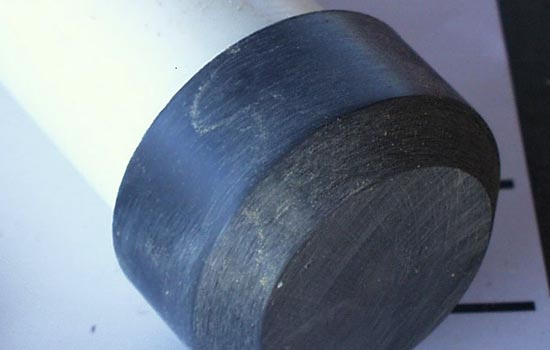 For the handle I used a 18″ long 1.5″(measured by inner dimension) PVC pipe with end cap. The end cap was cut to a height of 1.375″ and a .25″ bevel was sanded on the edge with the belt sander.
