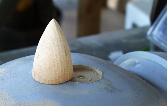 The spike was cut off to length of 2″ to fit into a hole routered into the top.