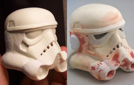 I cut off the “ears”, extended and reshaped the “snout” with putty, removed the front grill and “microphone” tips, cut out spaces in the “teeth” and lined the inside of the helmet with epoxy putty.