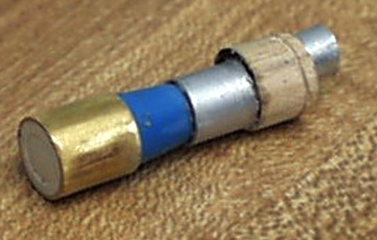  The scope was made from aluminum and brass tubing, a wooden dowel and the blue cone-shaped “clicker” from an ink pen. 