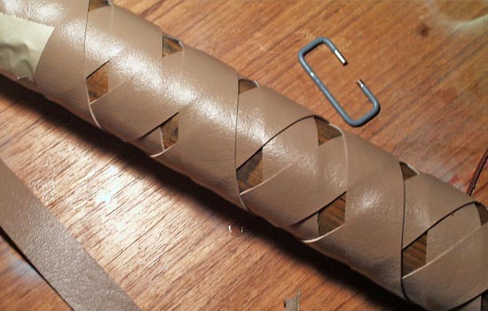  I wasn’t confident using leather but found a tan vinyl that I could cut myself. The grip was wrapped with four 60″ straps in a tight overlapping pattern. 