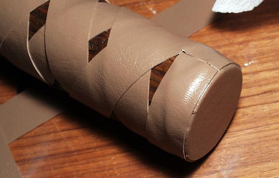 The pommel was covered with a circular piece of vinyl, glued over the edges and then wrapped with more vinyl strapping.