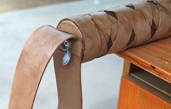 The loop was attached with a wood screw with a plastic snap-top cover.