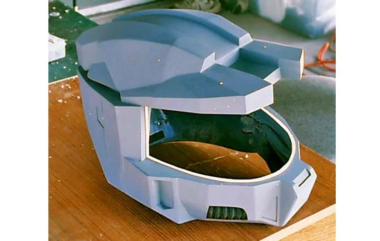 Here it is assembled with a thin support rail for the visor. I also inserted some rubber hose for the respirator. I plan to add cooling fans behind these.