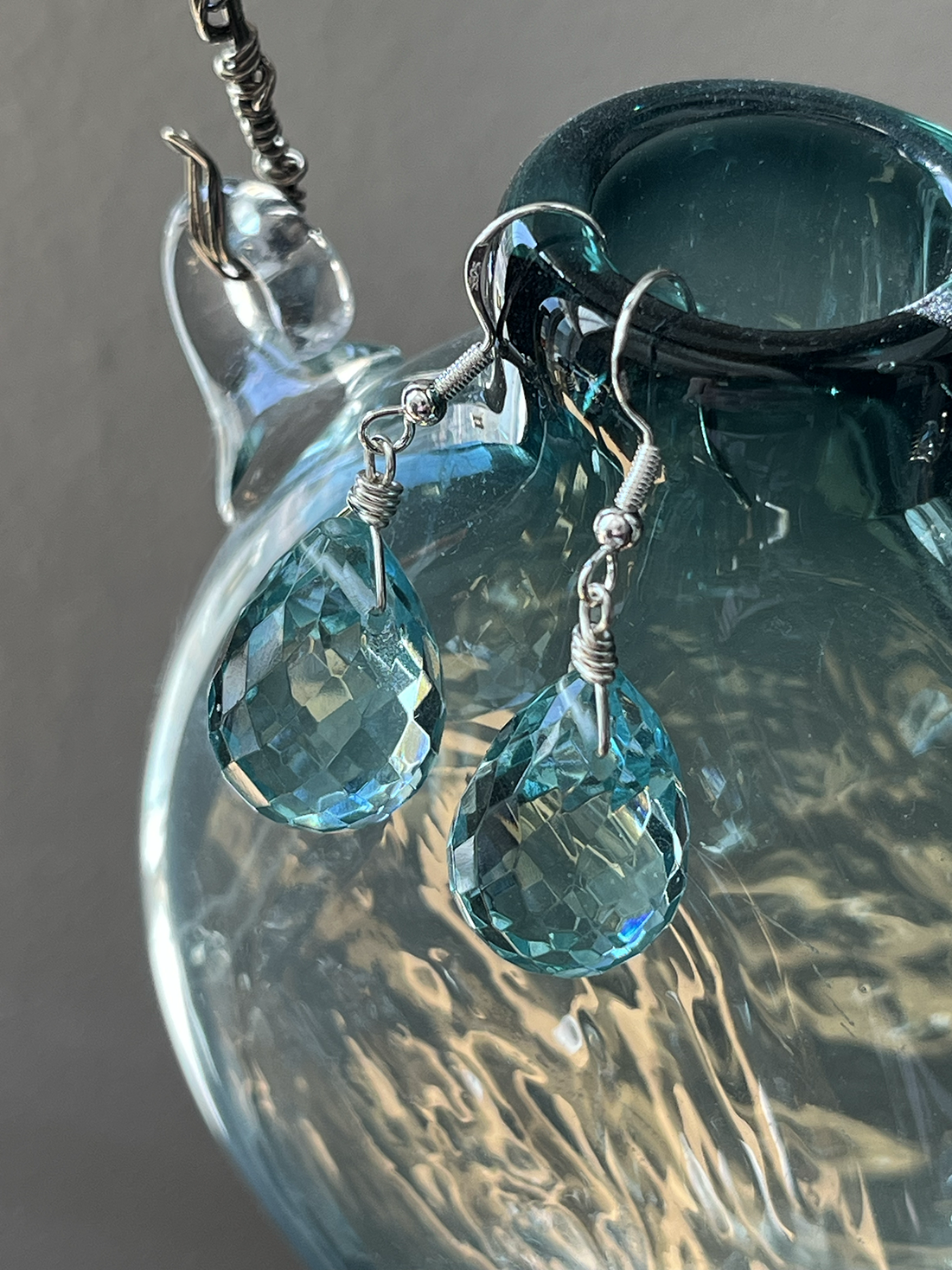 short blue crystal earrings flask.png
