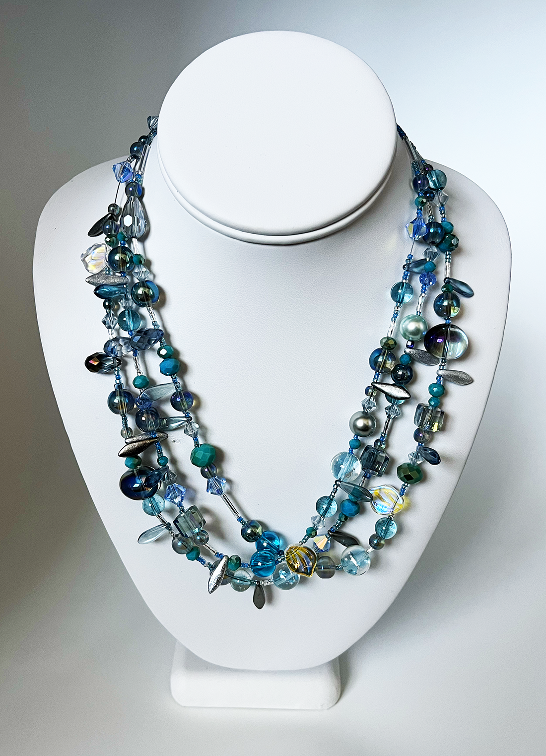 mixed blues necklace white.png