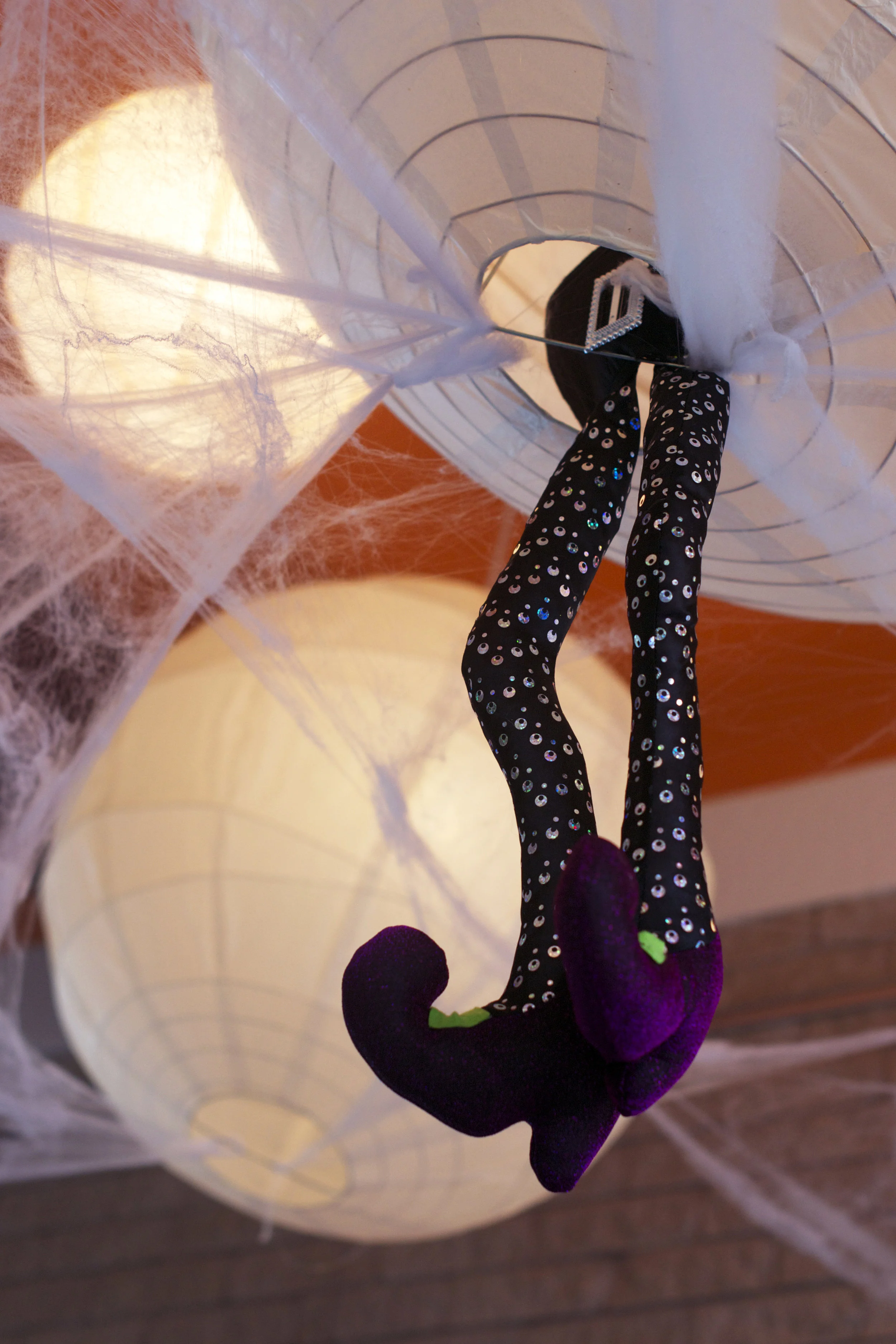 ceiling-decor-witches-legs-white-globes.jpg