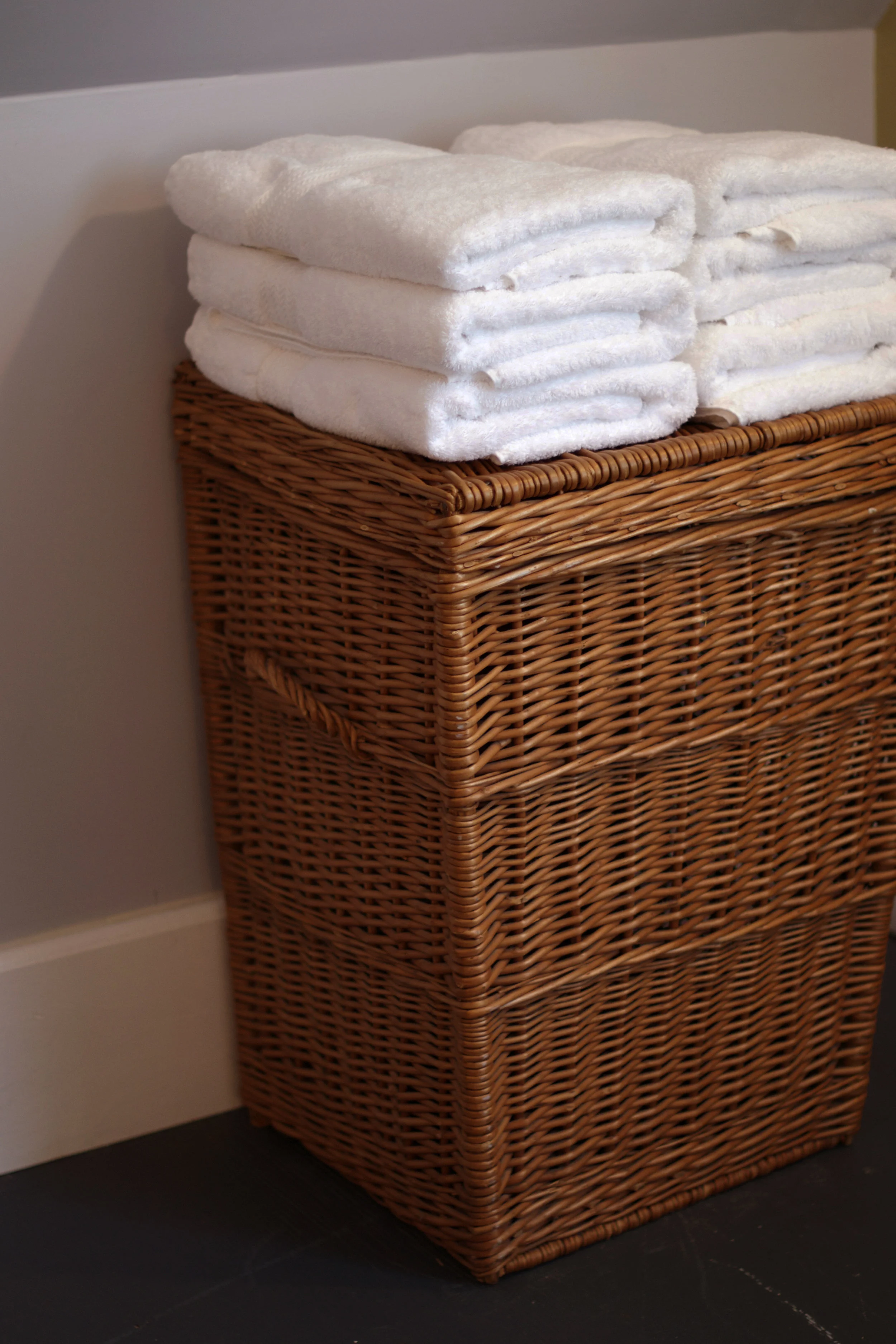 fluffy-white-towels-on-hamper.jpg