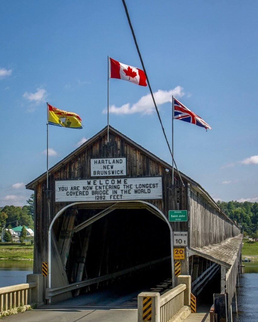 The Hartland Covered Bridge is the world&rsquo;s longest covered bridge at (1,282 ft or 391 m) long. When the bridge was used by horse &amp; wagon, couples would stop half-way across to share a kiss. ❤️ It is thought to also be good luck to hold one&