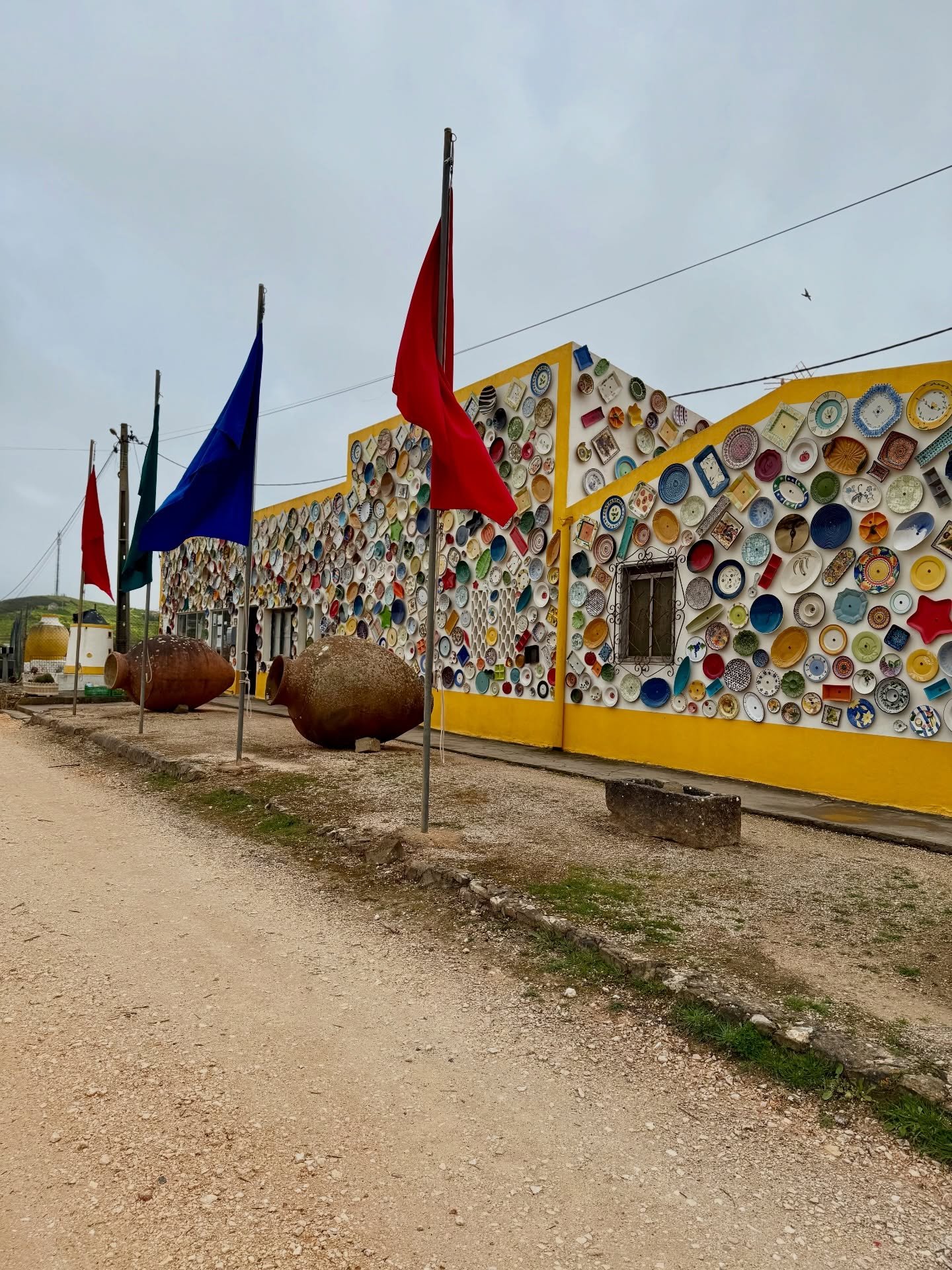 🎨 Walls that sing with colour, tradition, and joy.

Before you even step inside, Cer&acirc;mica Para&iacute;so stops you in your tracks. The exterior is a burst of hand-painted pottery&mdash;plates, tiles, and pots in brilliant blues, sunny yellows,