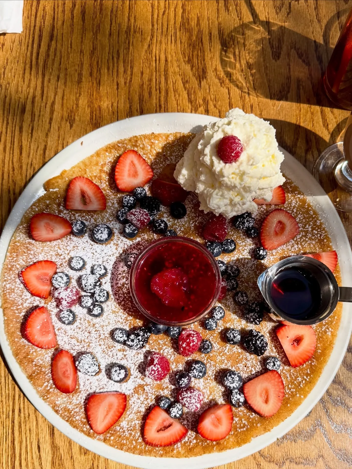 Proof that the best travel memories sometimes start with whipped cream. 🤤🥞

The Dutch Pannekoeken at @angelinasdutchcorner piled high with mixed berries and whipped cream was every bit as delicious as it looks. Pair it with waterfront views along t