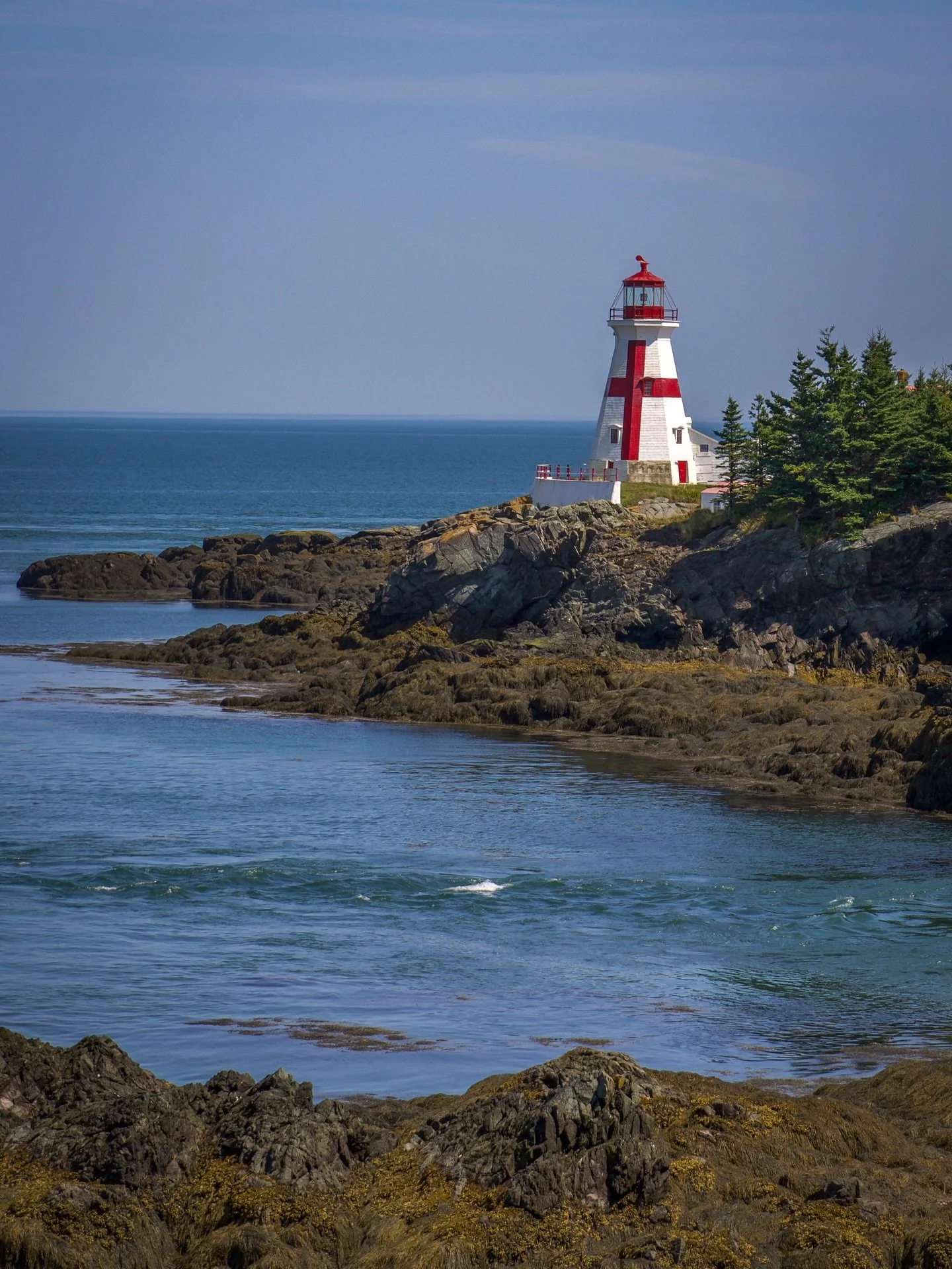 Campobello Island, New Brunswick, is a beloved Bay of Fundy escape where rugged coastlines, fascinating history, wildlife and quiet beaches invite you to slow down and explore. 🌊 

Walk out to the iconic Head Harbour Lightstation at low tide, wander