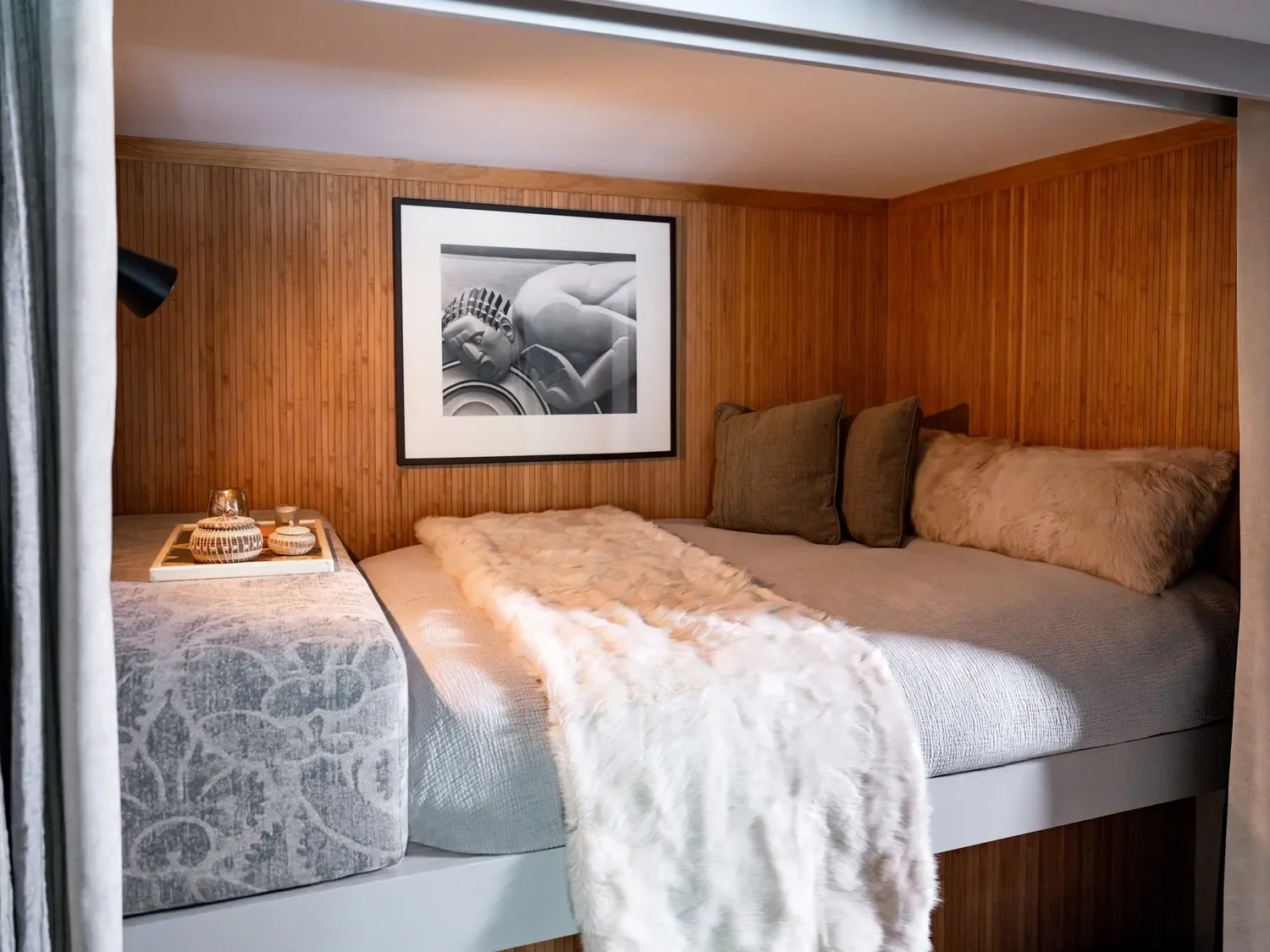 With two bamboo-paneled sleeping areas, this one resembles a couchette and might be the coziest napping nook on the property.