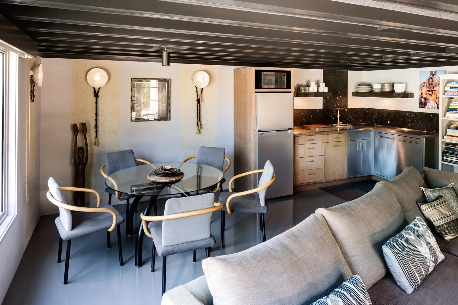 The 1955 sizable addition on a gently sloping site provided a second story, a separate living quarters hidden from street view. While perhaps lacking in ceiling height, it’s a spacious poolside retreat for guests complete with kitchenette. There’s a 