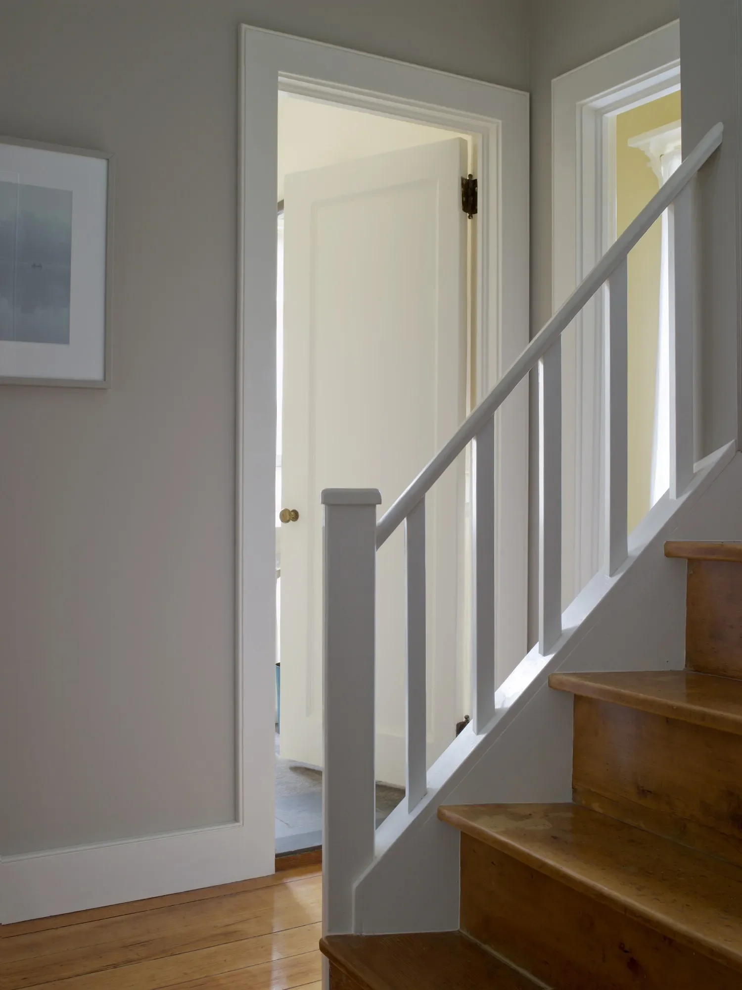 Only the stair treads and wood floors are original. Simple beaded moldings were milled locally. Doors and door hardware are from salvage dealers and the furniture purchased at regional yard sales. 