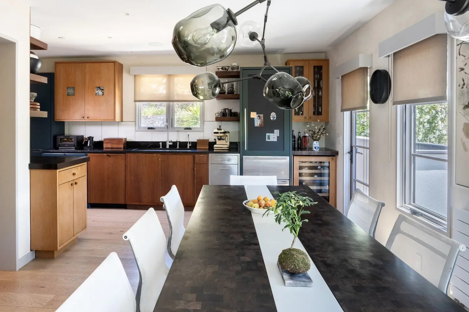 Our past investment in quality custom goods & appliances definitely warranted their cross-country transport and creative re-use in a very different setting. Only a couple additional new custom cabinets were needed to fill the gaps in a somewhat large