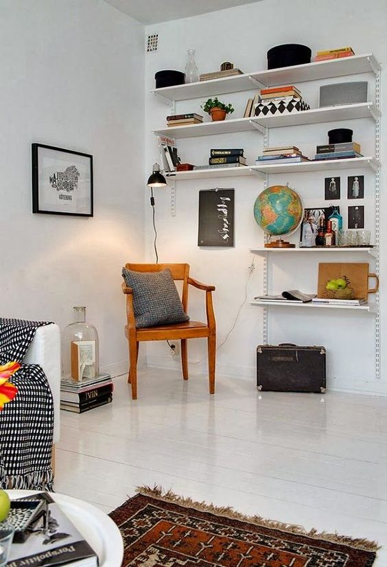 An adorable reading nook we found on Pinterest using simple Elfa shelving from The Container Store . Chic and modern - yet cozy.