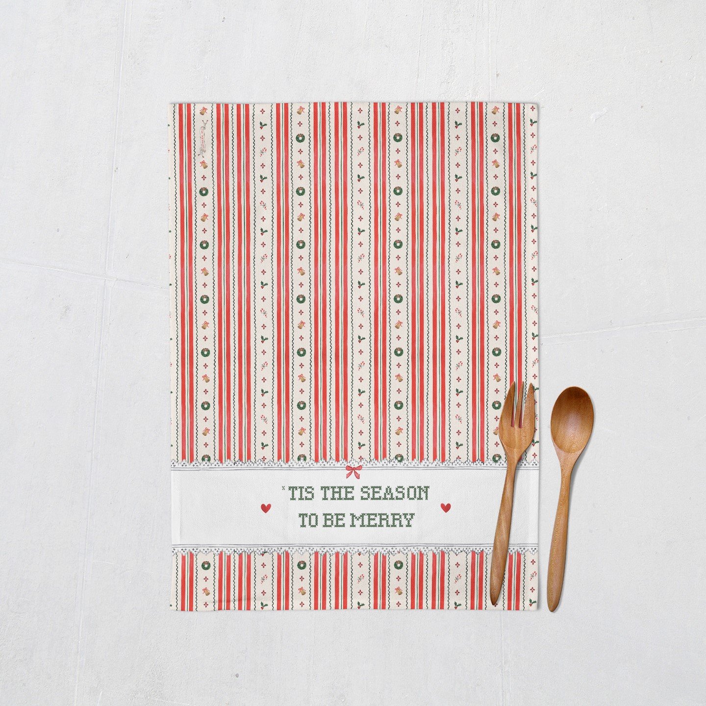 Tis the Season Christmas tea towel full view with wooden utensils