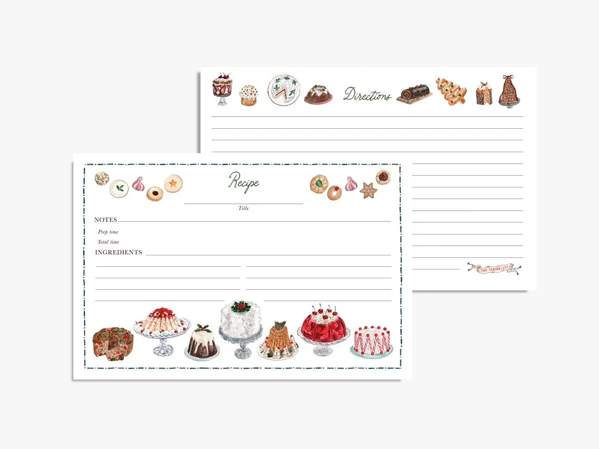 Christmas recipe cards decorated with watercolor vintage holiday desserts and cookies, with a lined directions side, styled on marble with a rolling pin, cookie cutters and evergreen sprigs
