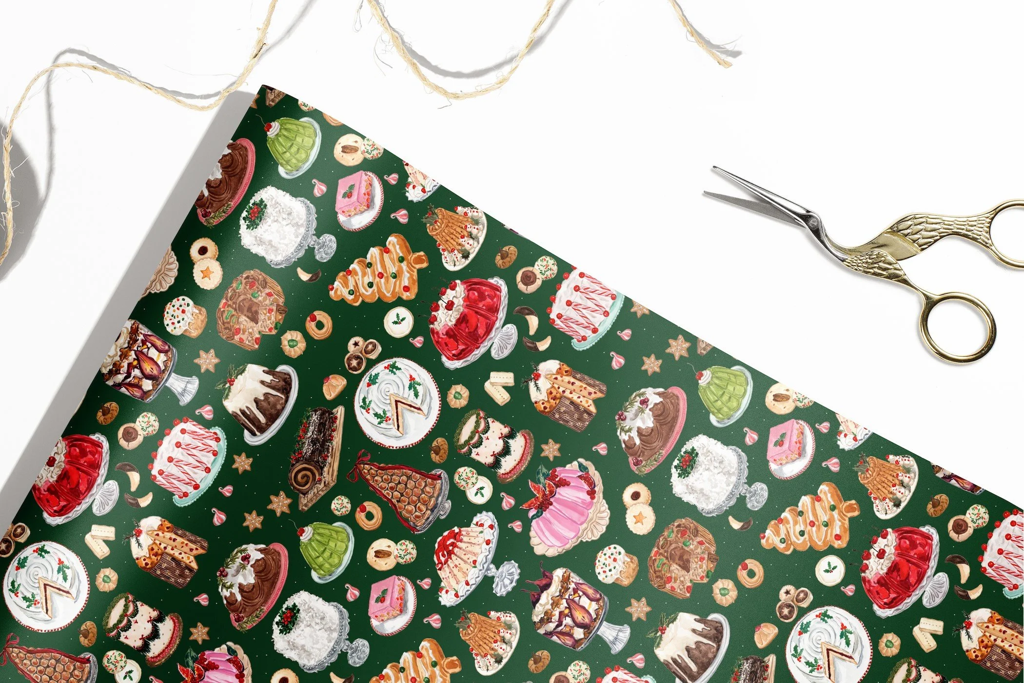 Single sheet view of Vintage Christmas Desserts Wrapping Paper by The Scribblist with twine and scissors
