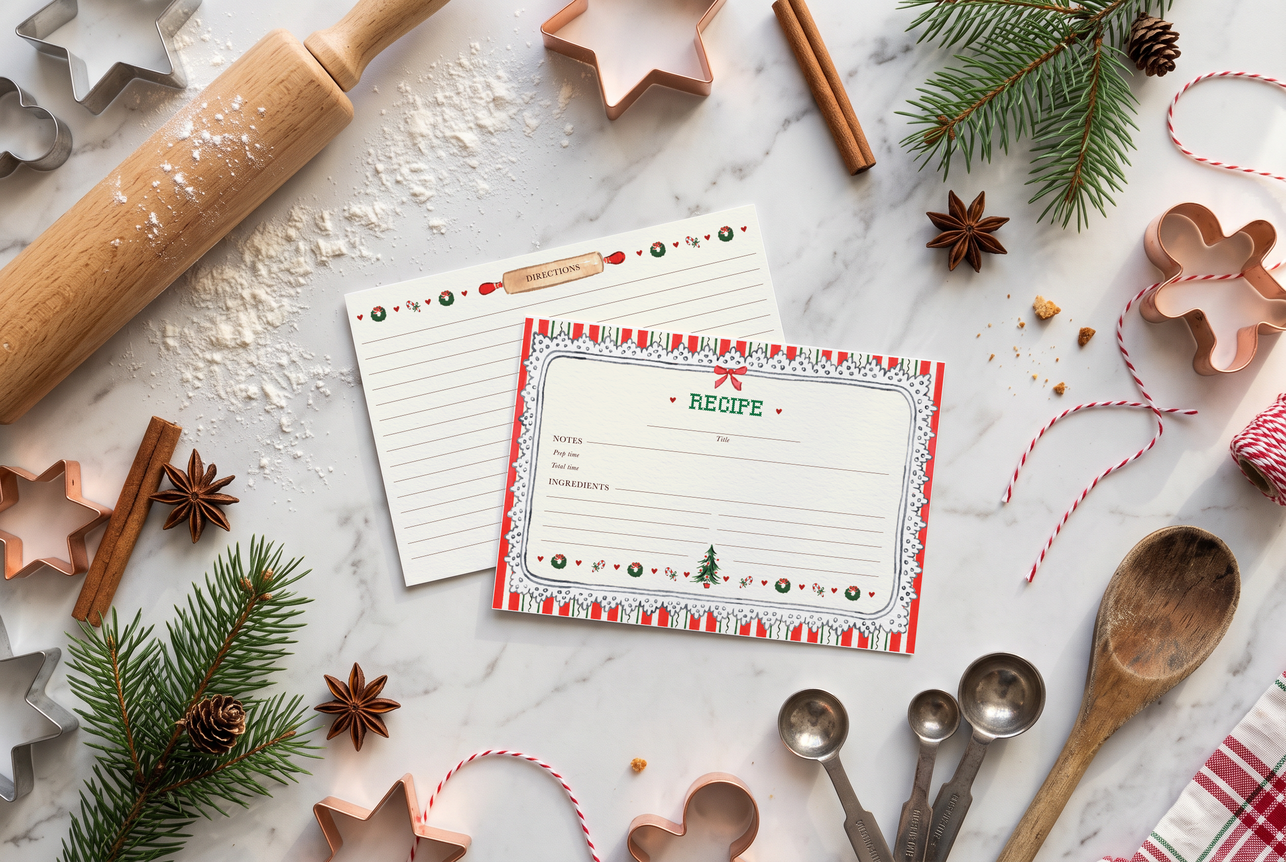 Watercolor Christmas Recipe Card by The Scribblist with lace eyelet frame and cross stitch details on a kitchen counter with baking tools