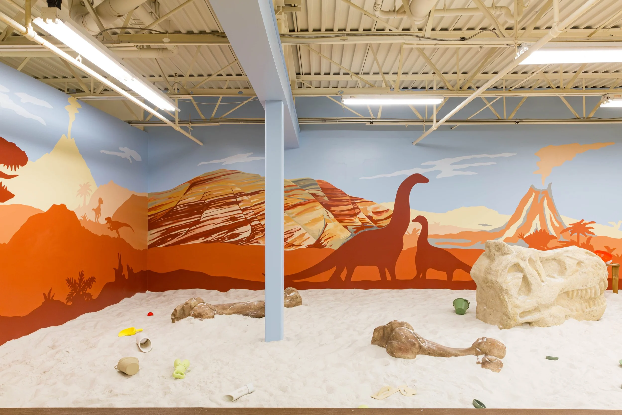 Mural of a prehistoric dinosaur scene and the Oregon Painted Hills by artist Amanda Donahue of The Scribblist.