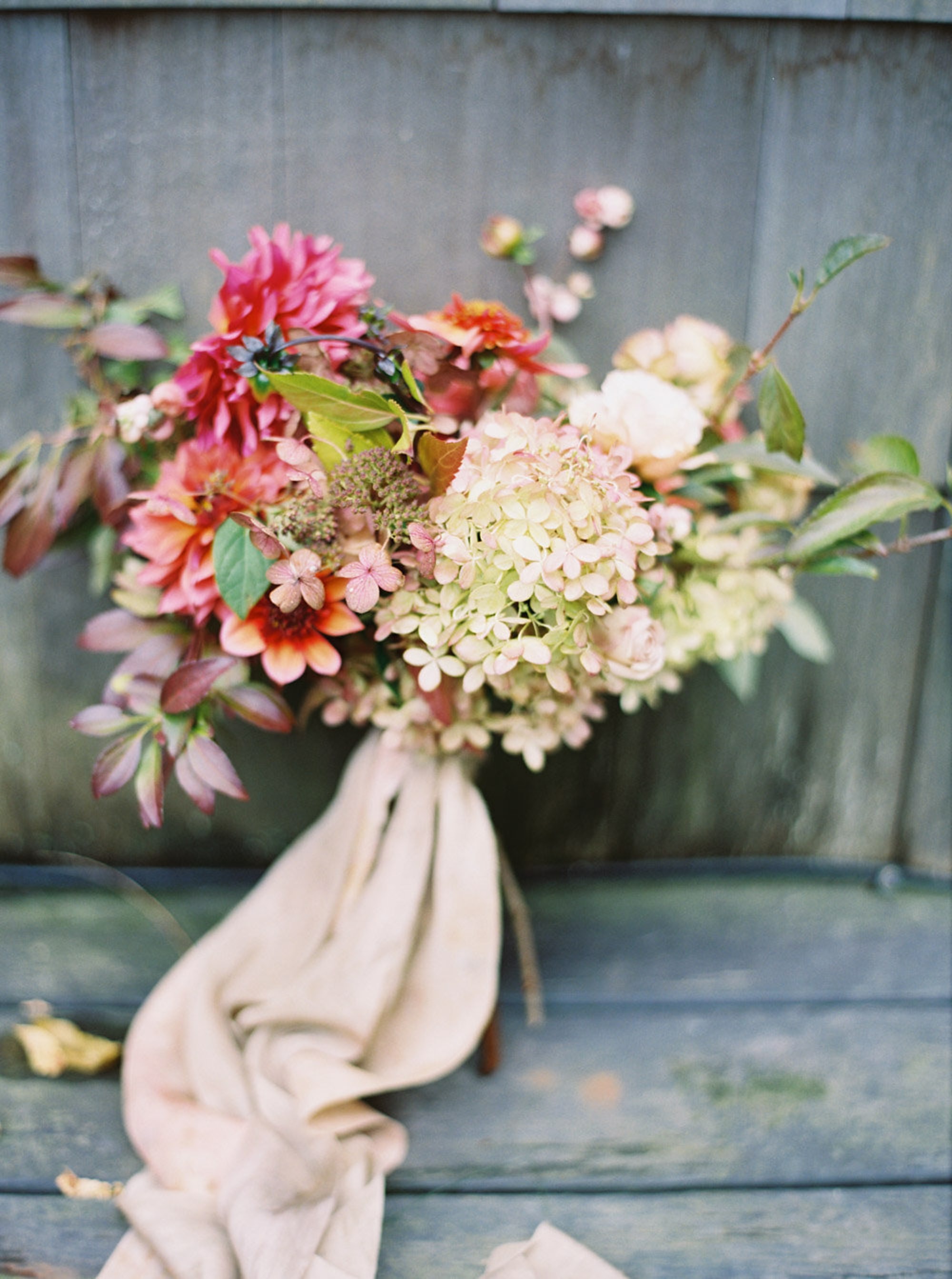 Bouquet of flowers resting on wooden background