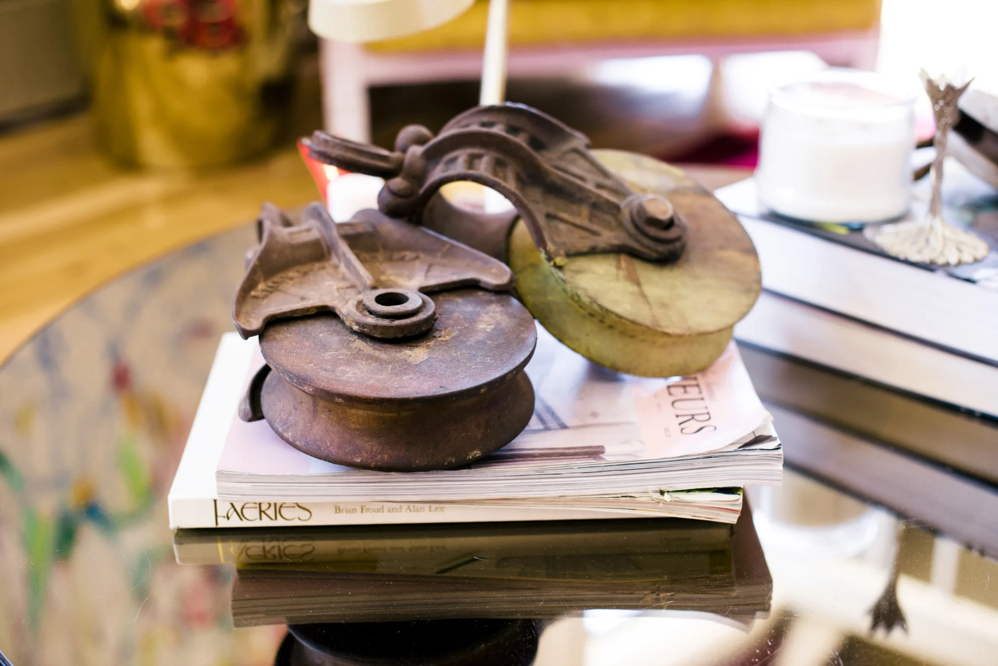 Coffee table with books and antique trolley wheels resting