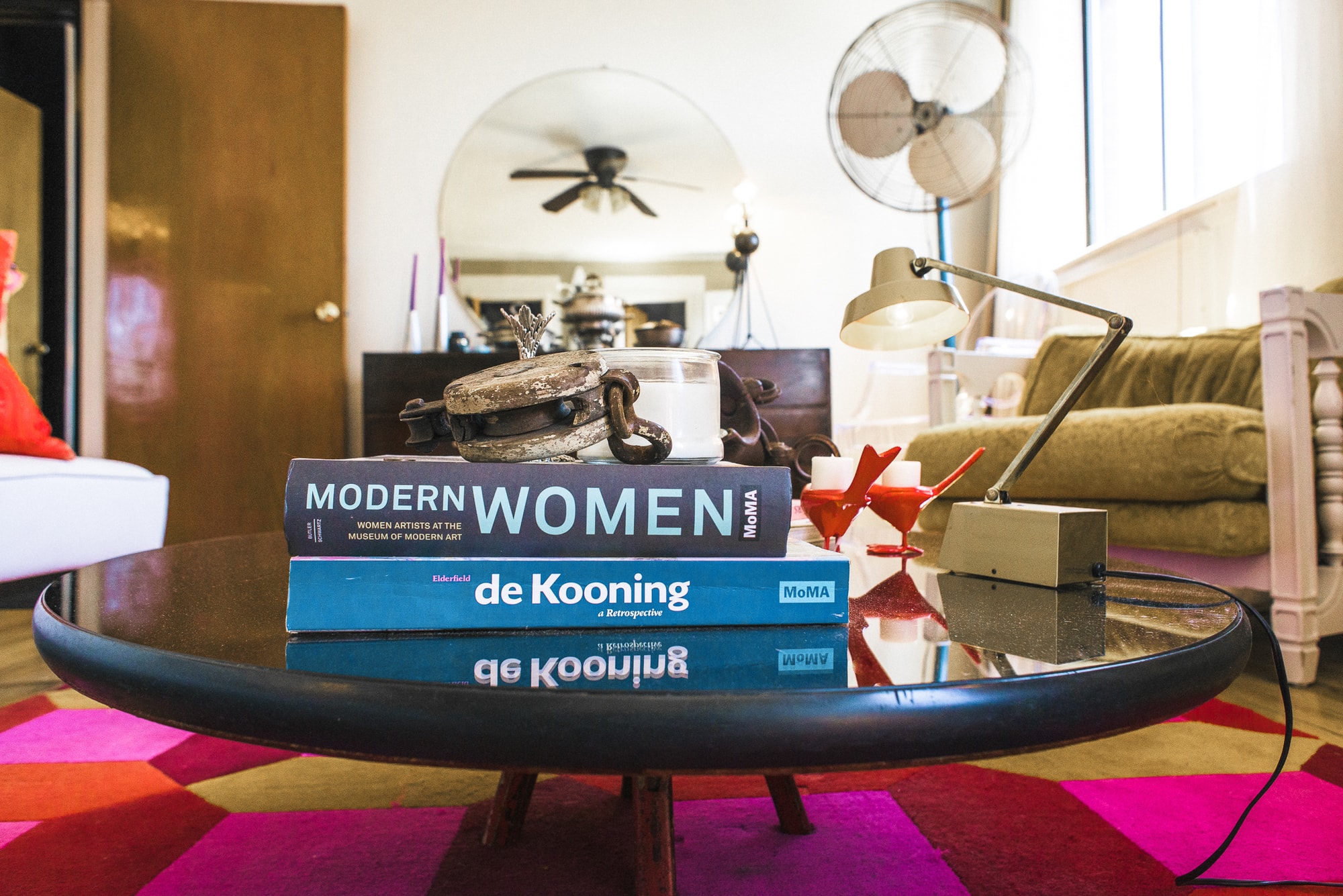 Coffee table with books and lamp resting