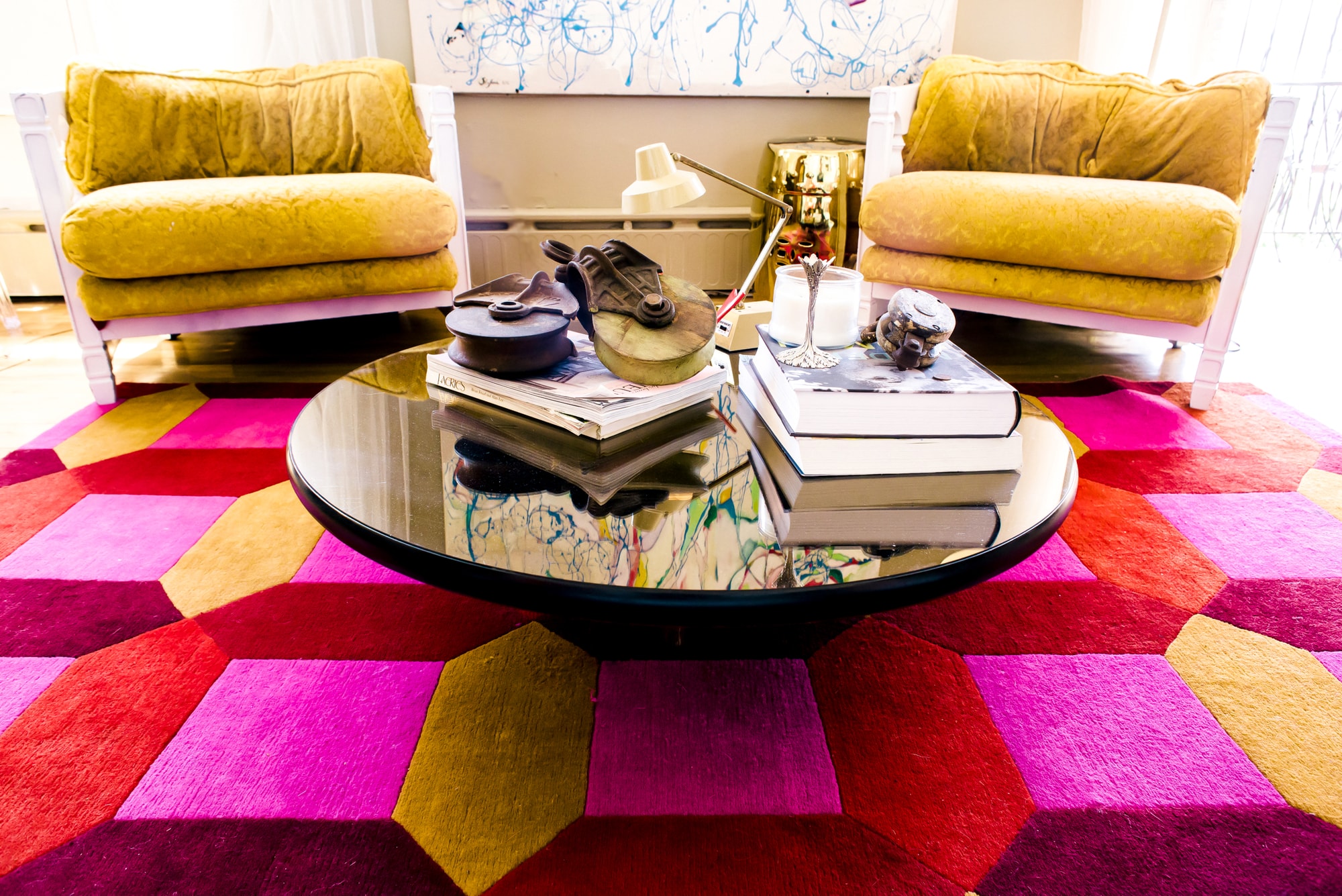 Coffee table on large colorful rug