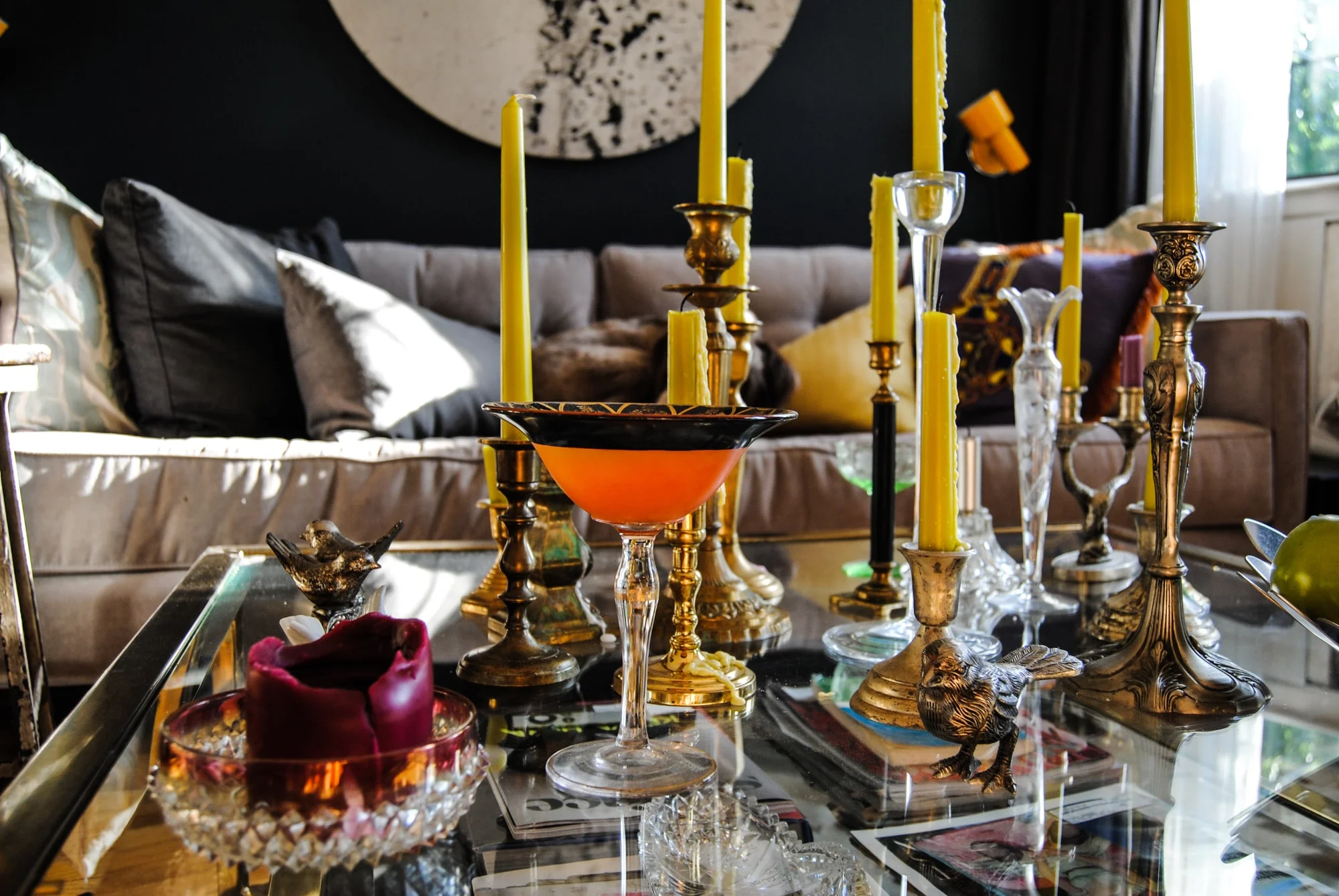 Glass coffee table with antique candle stick holders